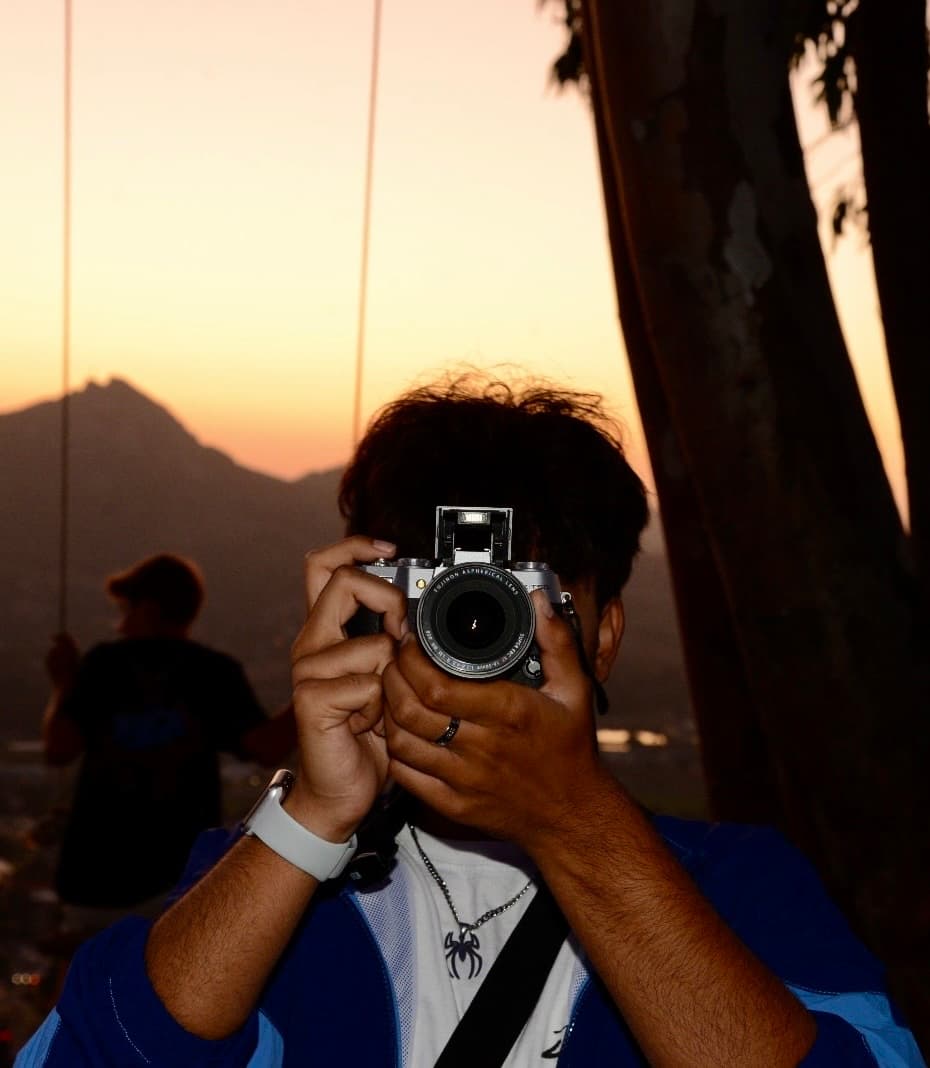 Using my camera at a sunset in SLO